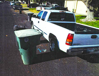 Waste bins too close to a collection truck